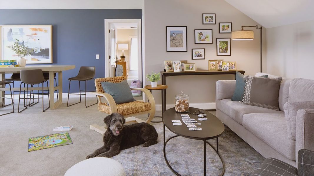 Furnished interior in a model home at The Courtyards at Hodges Farm in Charlotte (Image 29).