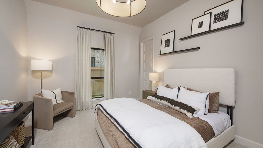 Furnished interior in a model home at The Highlands 65' in Porter (Image 22).