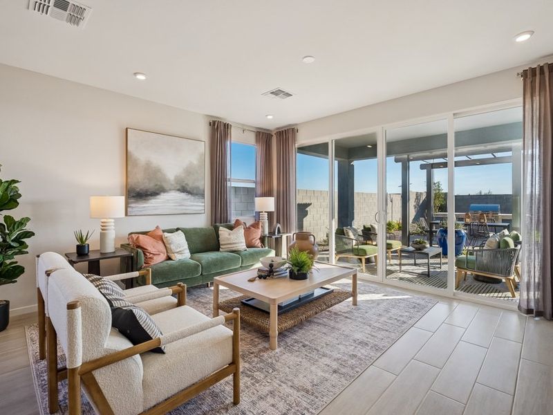 A living room with a large glass door. A living room with a large glass door.