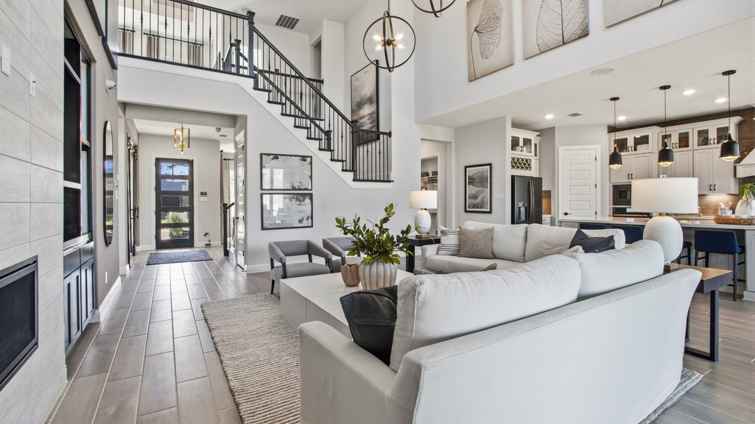 Experience luxury with high ceilings, sleek fireplace, and elegant decor in Mostyn Manor Reserve. Experience luxury with high ceilings, sleek fireplace, and elegant decor in Mostyn Manor Reserve.