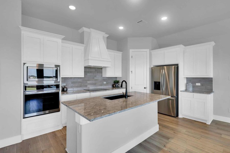 Furnished interior in a model home at Brahman Ranch in Venus (Image 4).