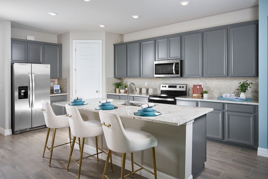 Kitchen in the Jay floorplan modeled at Crescent Lakes at Babcock Ranch