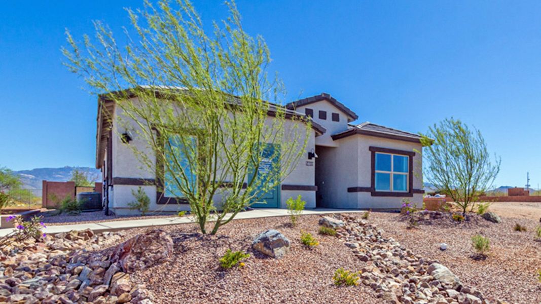 Front exterior of a home in the The Oasis at Rocking K community, located in Vail, AZ (Image 8).