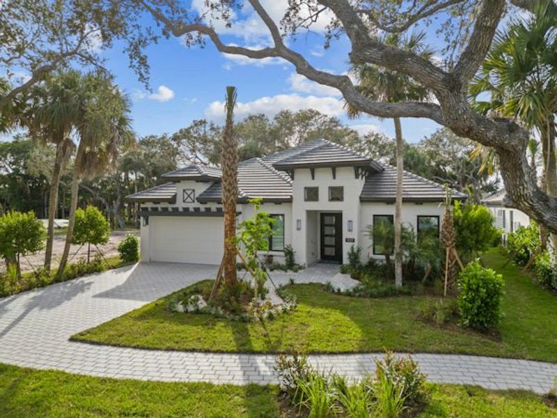 Front exterior of a home in the Seaglass community, located in Vero Beach, FL (Image 64).