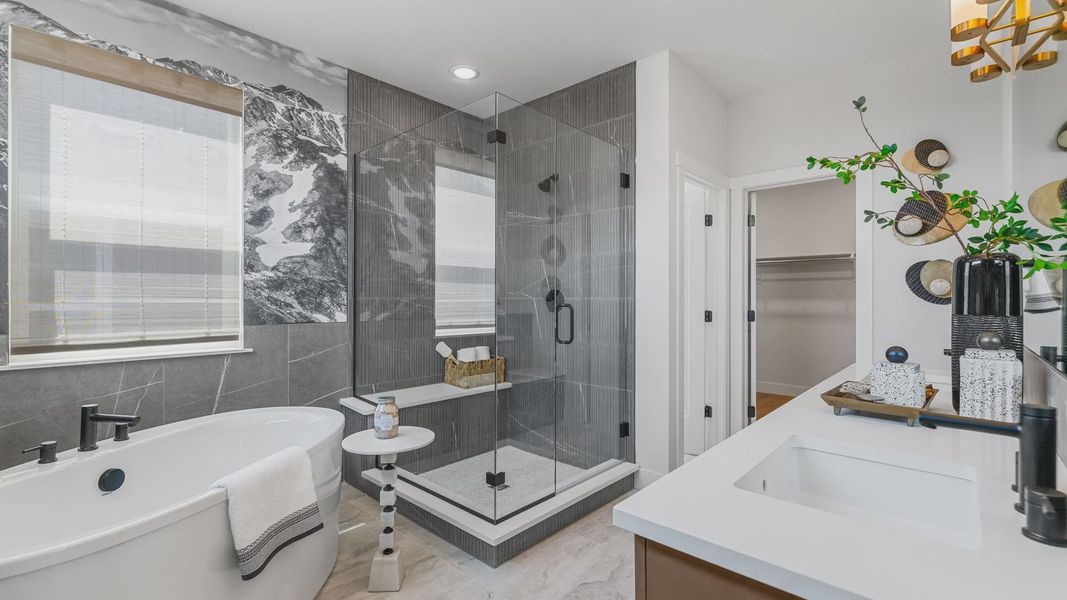 Experience refined elegance with a freestanding tub and an artistic mountain mural in Dillon Pointe's exclusive bath. Experience refined elegance with a freestanding tub and an artistic mountain mural in Dillon Pointe's exclusive bath.