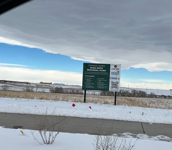 Snowy landscape with a sign for an upcoming regional park in Lyric at Ridgegate by Infinity Properties (Lone Tree, CO). Snowy landscape with a sign for an upcoming regional park in Lyric at Ridgegate by Infinity Properties (Lone Tree, CO).