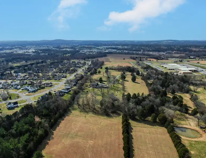 A landscape with trees and buildings.