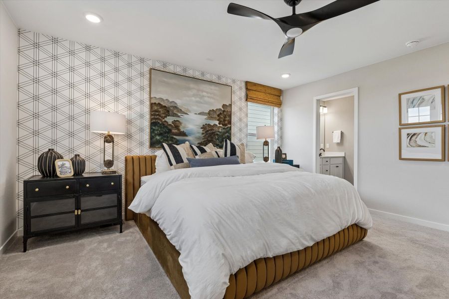 A bedroom with a large bed.
