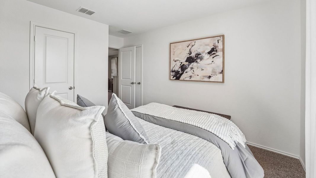 Furnished interior in a model home at Palomino in Manor (Image 31).
