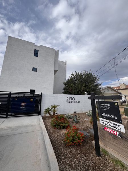Modern white building with minimalist design and landscaped entry in Turney Court by Bolte Homes, Phoenix, AZ. Modern white building with minimalist design and landscaped entry in Turney Court by Bolte Homes, Phoenix, AZ.