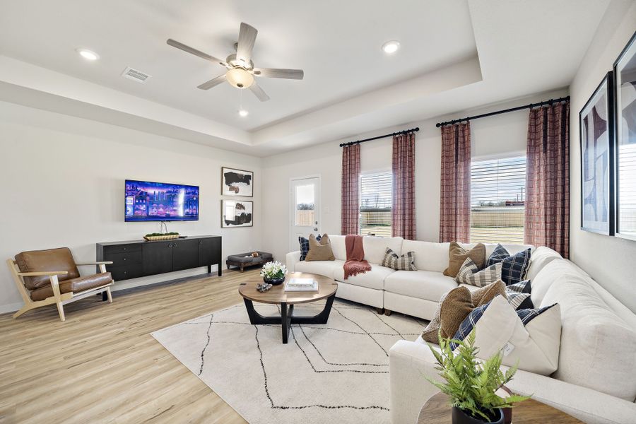 A living room with a large television. A living room with a large television.