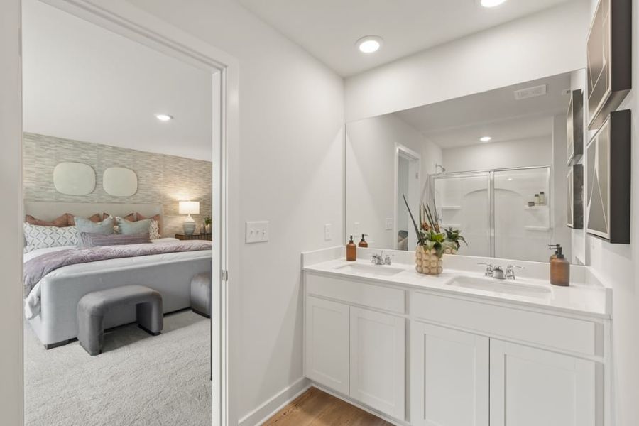 A bathroom with a large mirror. A bathroom with a large mirror.