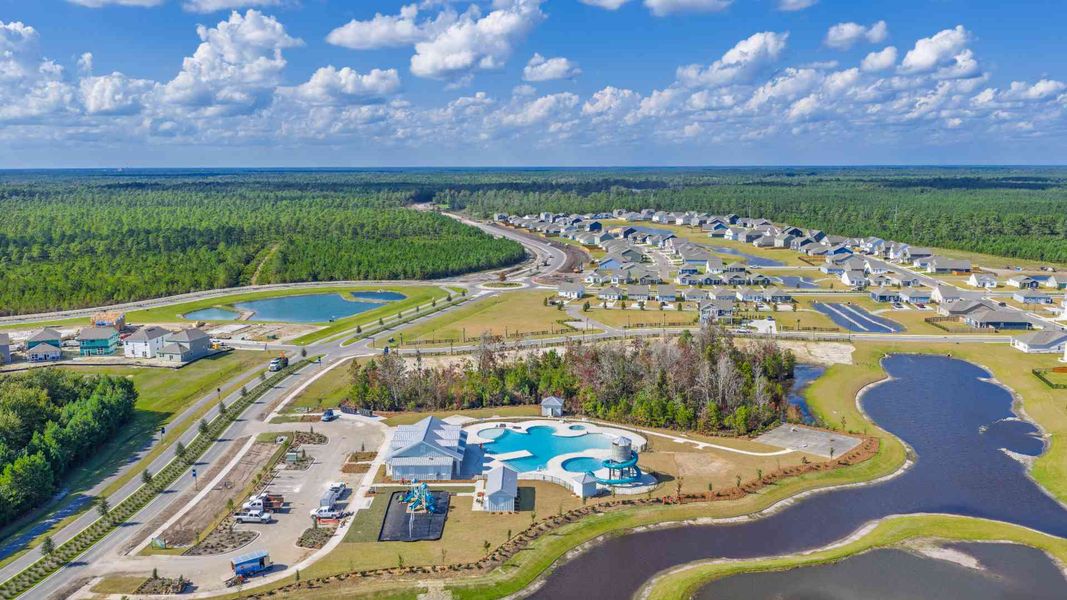 Aerial view of the The Grove at Blake Farm community in Wilmington, NC, showing layout and nearby surroundings (Image 1). Aerial view of the The Grove at Blake Farm community in Wilmington, NC, showing layout and nearby surroundings (Image 1).