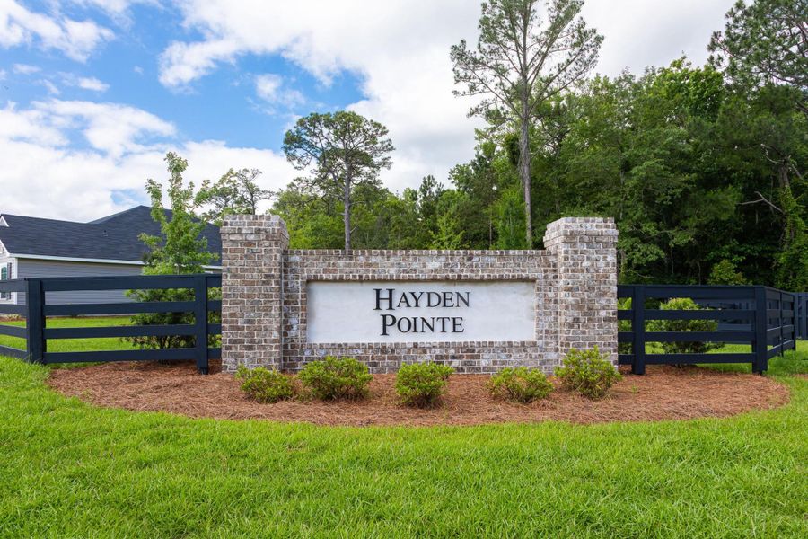 Entrance to the Hayden Pointe community in St. Marys, GA, featuring signage and landscaping (Image 1).