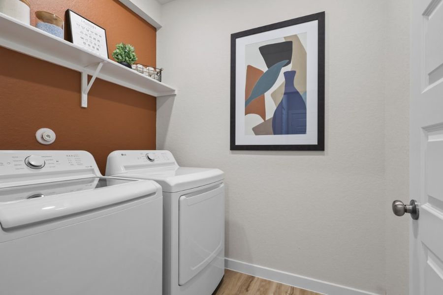 A white wall with a picture on it and a picture on the wall.