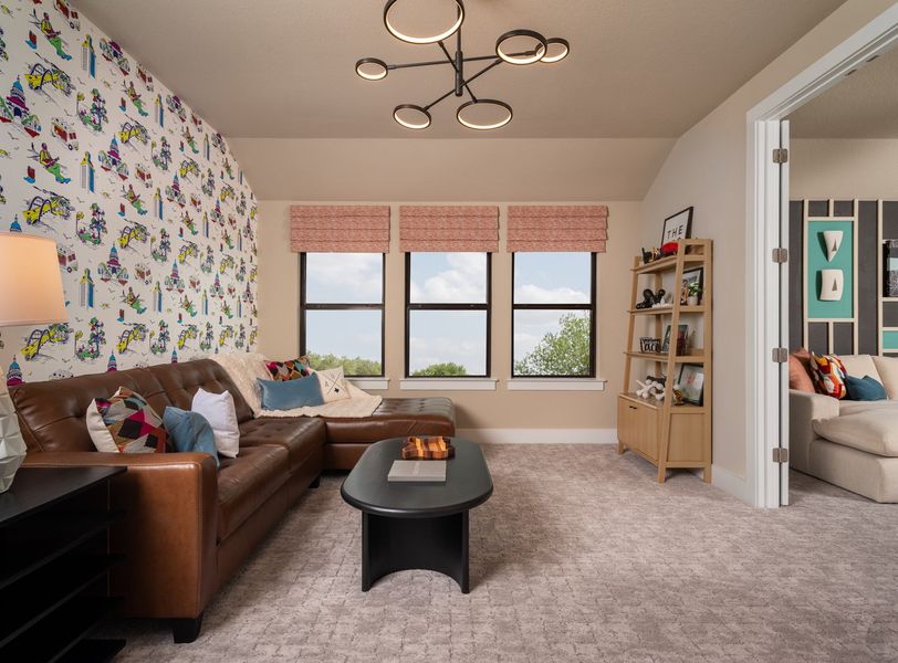 Furnished interior in a model home at Bluffview Reserve in Leander (Image 10).