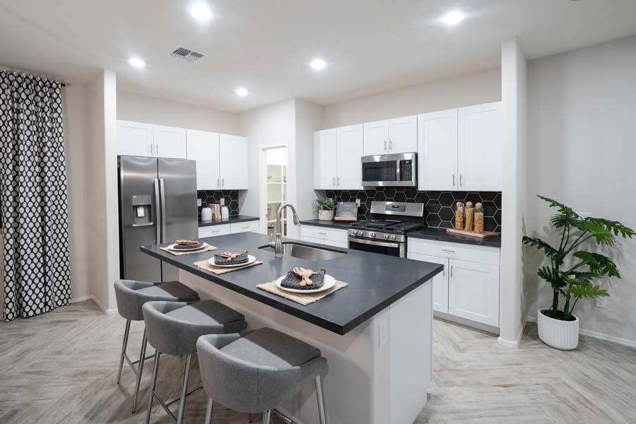 Furnished interior in a model home at Beacon Hill at Marley Park in Surprise (Image 40).