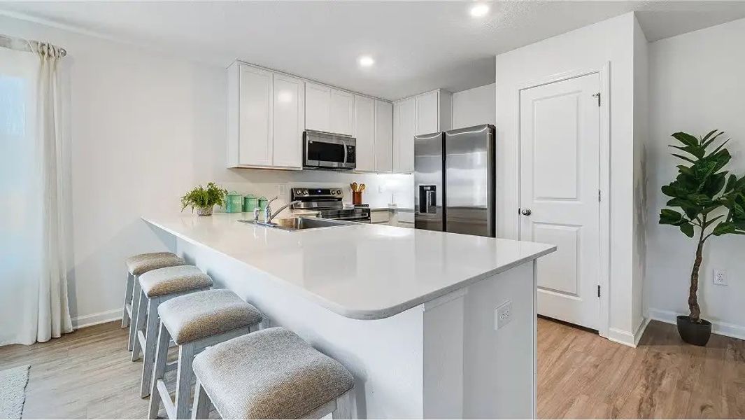 Furnished interior in a model home at Eagle's Ridge: Watermill in Pace (Image 6).