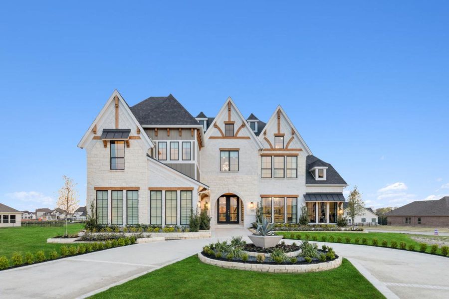 Front exterior of a home in the Heath Golf & Yacht Club community, located in Heath, TX (Image 4). Front exterior of a home in the Heath Golf & Yacht Club community, located in Heath, TX (Image 4).