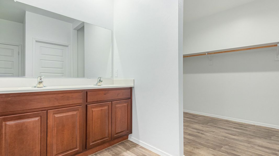 Furnished interior in a model home at Roadrunner Estates in Tucson (Image 28).