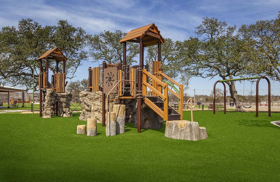 This distinctive playground features premium wooden structures set against vibrant greenery at Meyer Ranch.