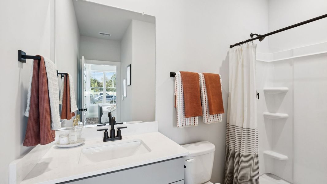 Furnished interior in a model home at Harvest Point in Spring Hill (Image 75).