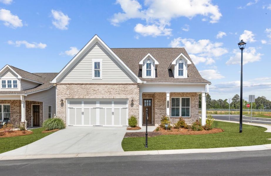 Front exterior of a home in the Courtyards at Traditions community, located in Cumming, GA (Image 2).