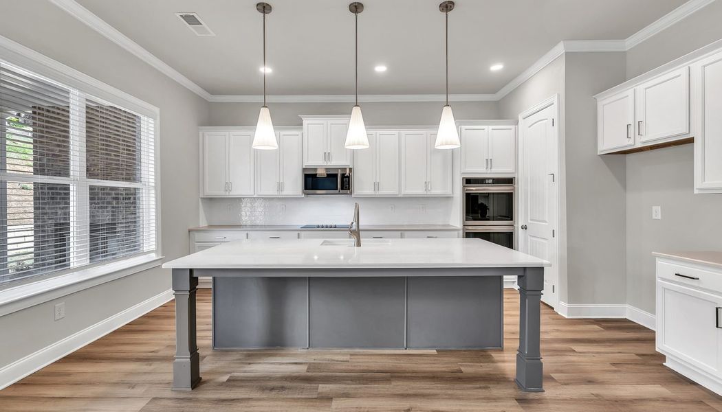 Furnished interior in a model home at Traditions of Braselton in Jefferson (Image 32).