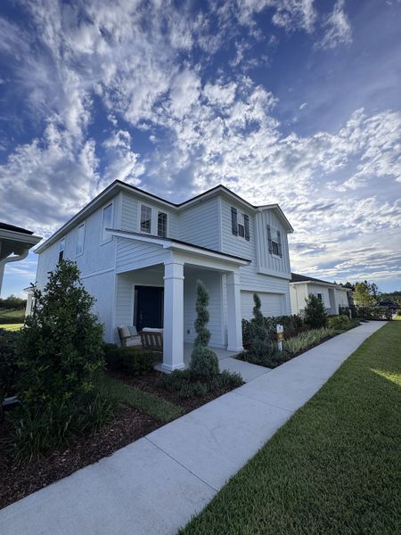 A charming two-story home with a neat lawn and inviting porch in Amberly by Dream Finders Homes (Green Cove Springs, FL). A charming two-story home with a neat lawn and inviting porch in Amberly by Dream Finders Homes (Green Cove Springs, FL).