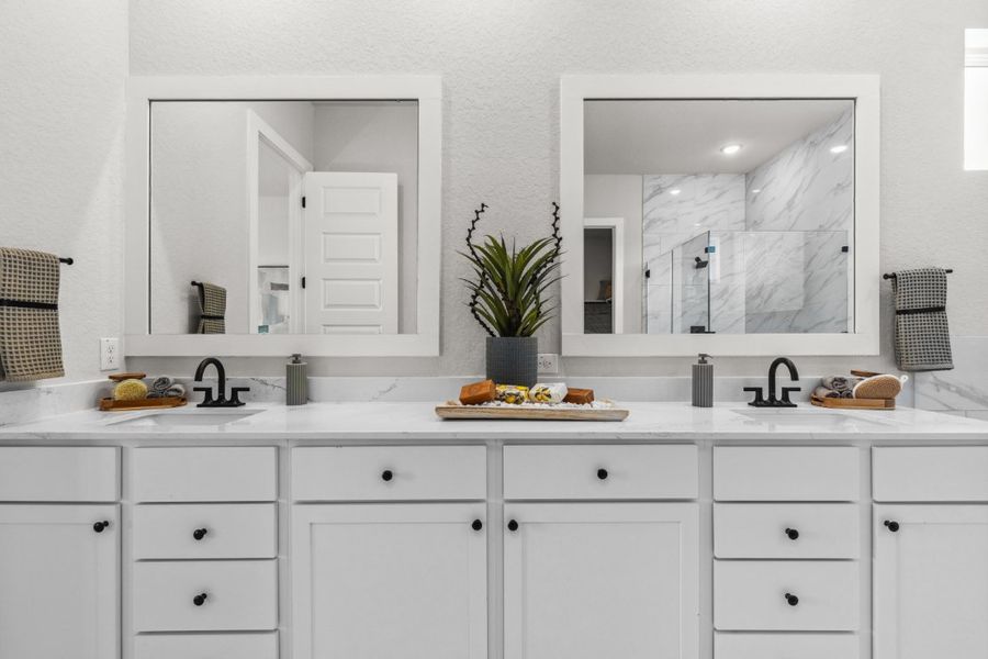 A white kitchen with white cabinets.