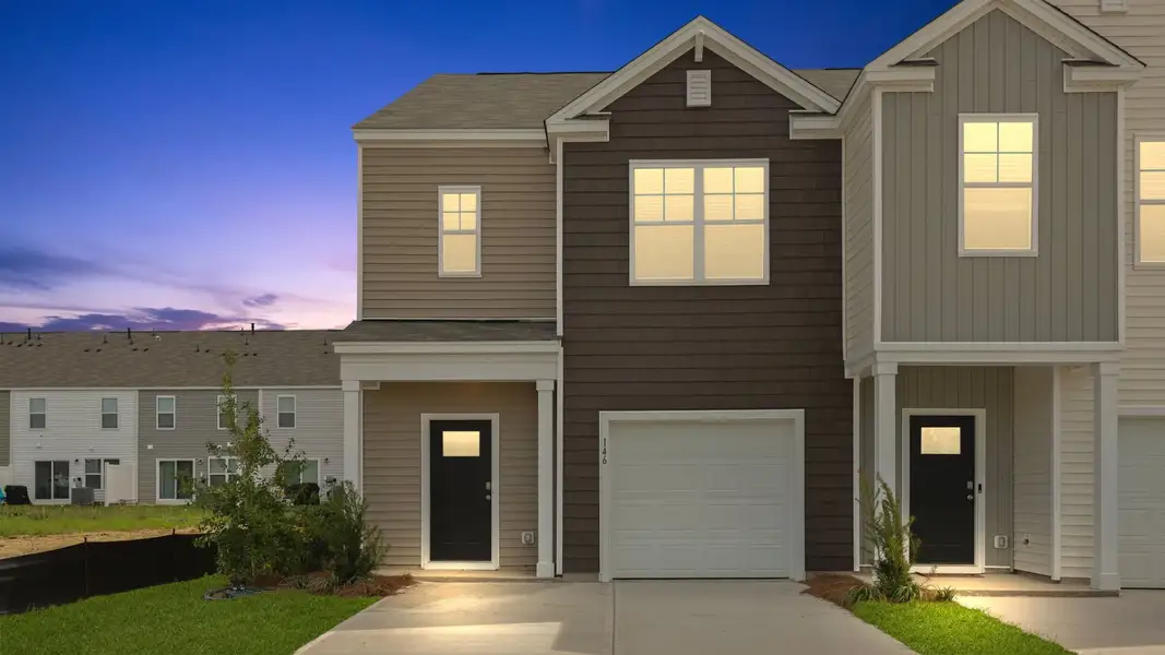 Front exterior of a home in the Carolina Groves Townhomes community, located in Moncks Corner, SC (Image 3).
