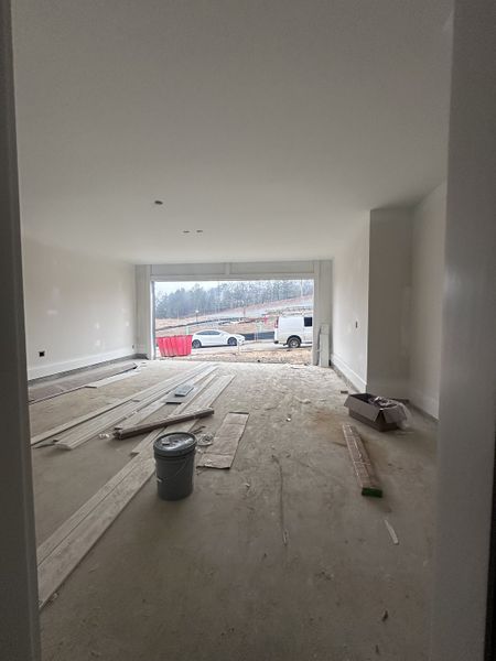 A spacious unfinished garage with wide entry and natural light, ready for customization.