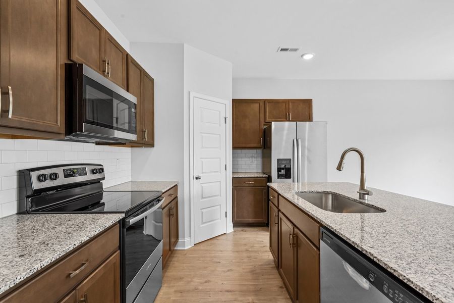 Furnished interior in a model home at Marin Woods Townhomes in Smithfield (Image 8).