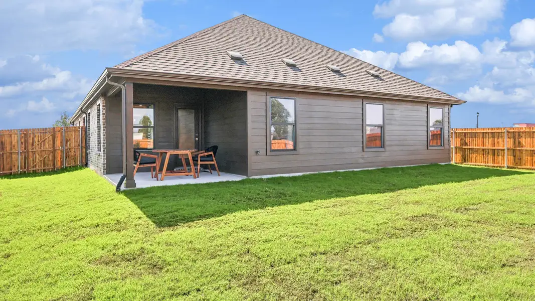 Enjoy the elegant wood siding and covered patio in Pebblebrook's lush backyard setting.