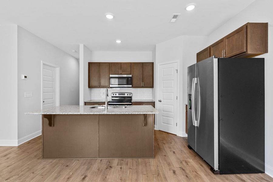 Furnished interior in a model home at Marin Woods Townhomes in Smithfield (Image 9).