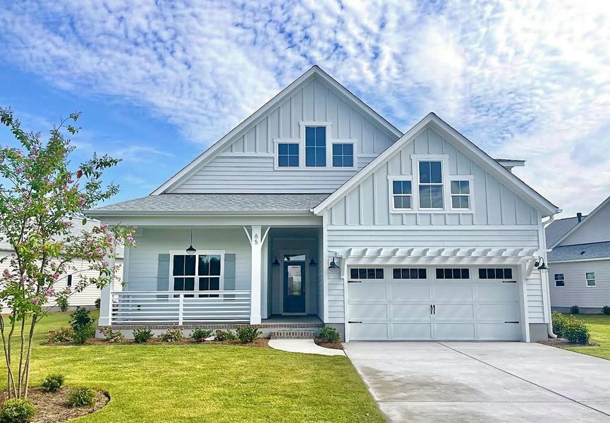 Front exterior of a home in the Songbird community, located in Hampstead, NC (Image 11). Front exterior of a home in the Songbird community, located in Hampstead, NC (Image 11).