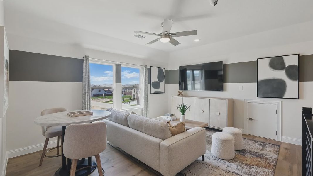 Elegant living area with marble accents and abstract art. Located in Rio Vista at Kelly Ranch. Elegant living area with marble accents and abstract art. Located in Rio Vista at Kelly Ranch.