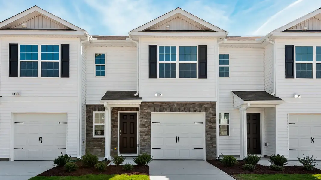 Front exterior of a home in the The Townes at Ridgewood Farms community, located in Winterville, NC (Image 4).