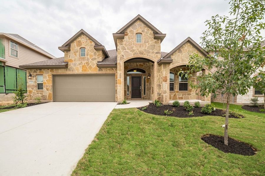 Front exterior of a home in the Sunfield community, located in Buda, TX (Image 4).
