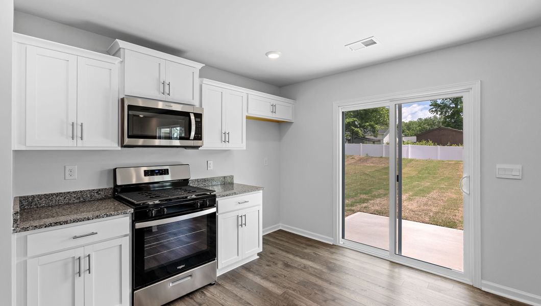Furnished interior in a model home at Village Grove in Greenville (Image 6).
