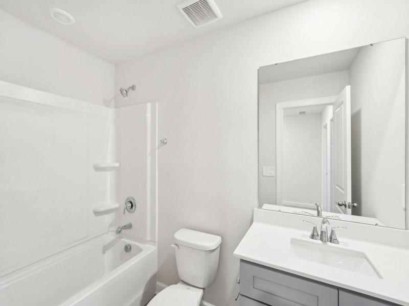 Furnished interior in a model home at Crossrail Station in Mooresville (Image 14).