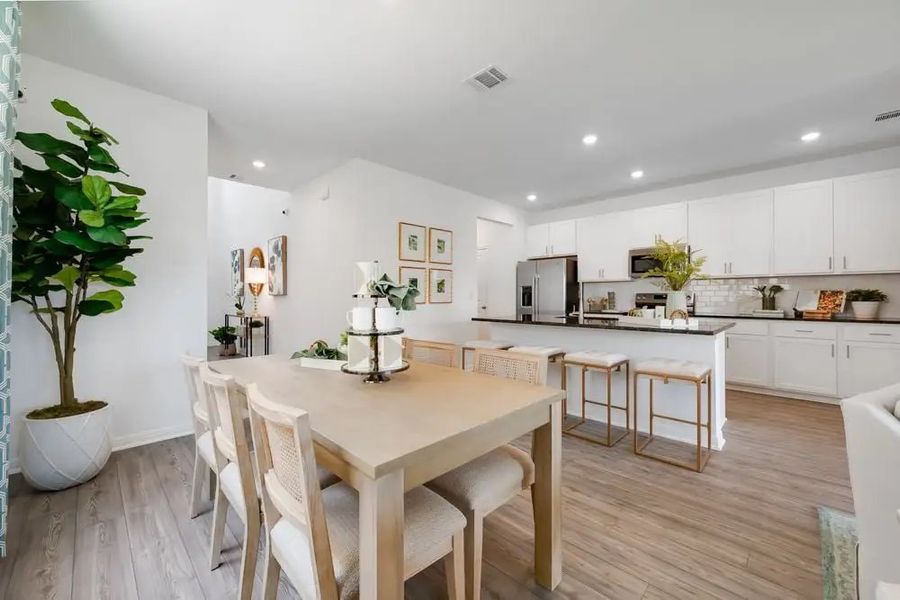 Furnished interior in a model home at Village Grove in Dripping Springs (Image 3).