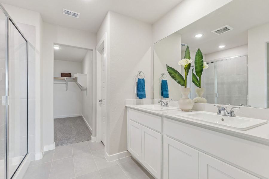 Primary Bathroom in the Hayden home plan by Trophy Signature Homes - REPRESENTATIVE PHOTO