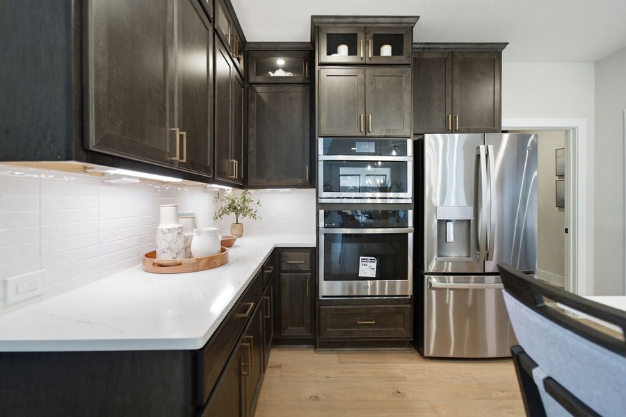 Furnished interior in a model home at Grand Magnolia in Waller (Image 29).