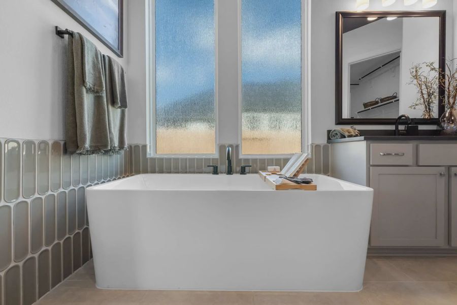 Furnished interior in a model home at Attwater 65's in Waller (Image 6).