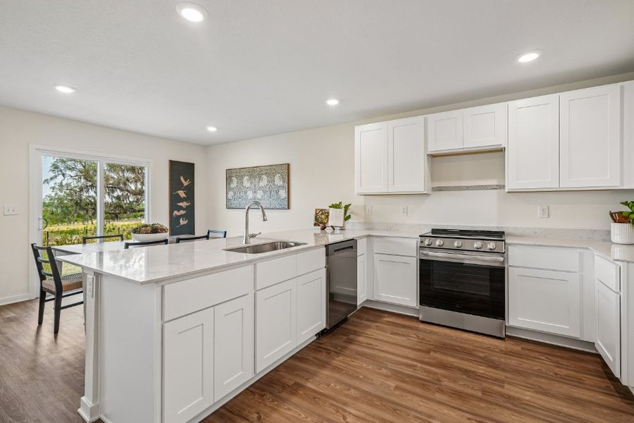 A kitchen with white cabinets. A kitchen with white cabinets.