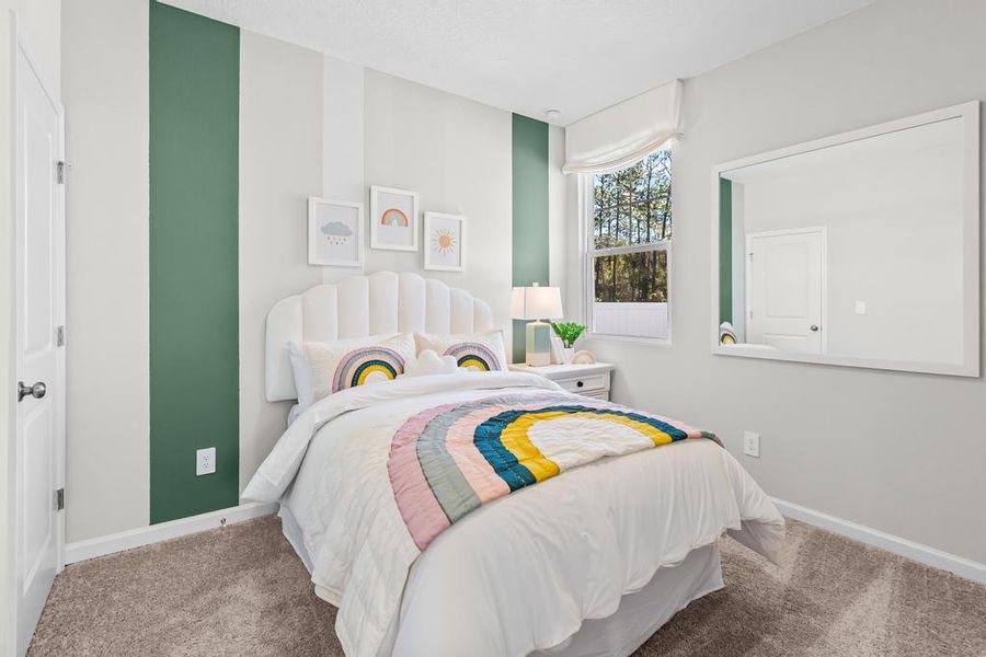 A bedroom with a bed and a window. A bedroom with a bed and a window.