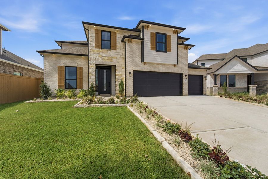Front exterior of a home in the Grand Magnolia community, located in Waller, TX (Image 10).