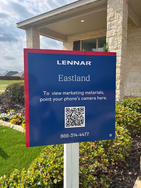 A charming stone façade with vibrant landscaping in Eastland: Watermill Collection by Lennar (Crandall, TX).