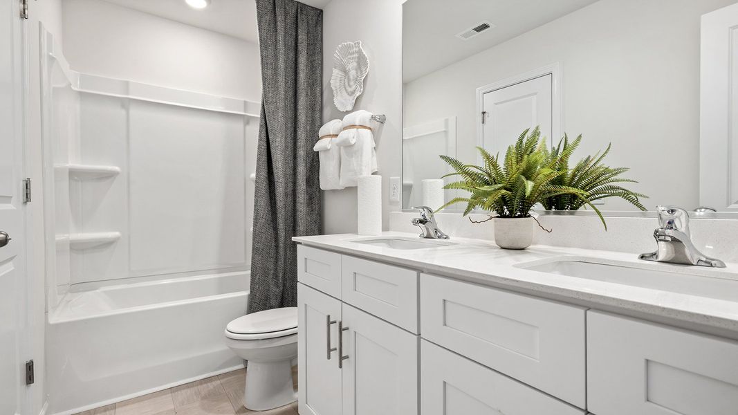 Furnished interior in a model home at The Reserve at Stoney Creek in Whitsett (Image 22).